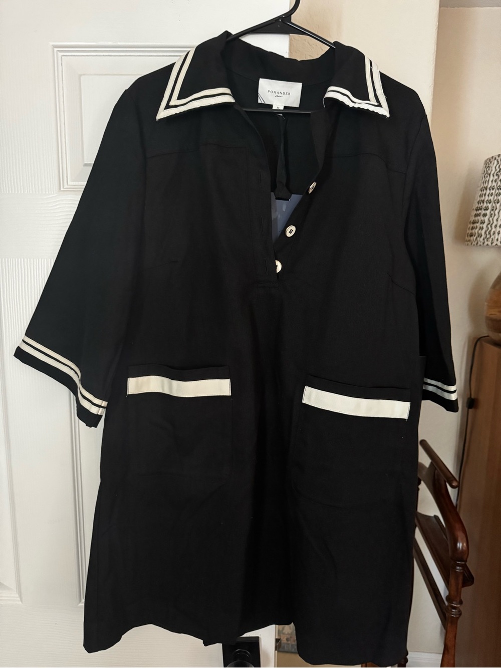Pomander Place Black Garment with White Brand Tag